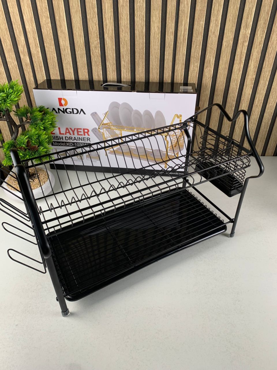 Two-tier dish drying rack with drip tray from تنزوت, perfect for organizing and drying kitchen utensils and dishes.